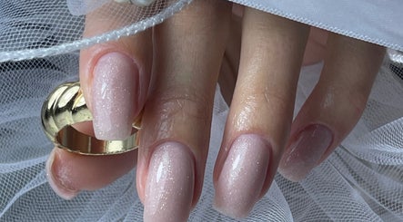 Elegant bridal nails at n.15Studio, Addlestone, England, GB with a gold ring and veil.