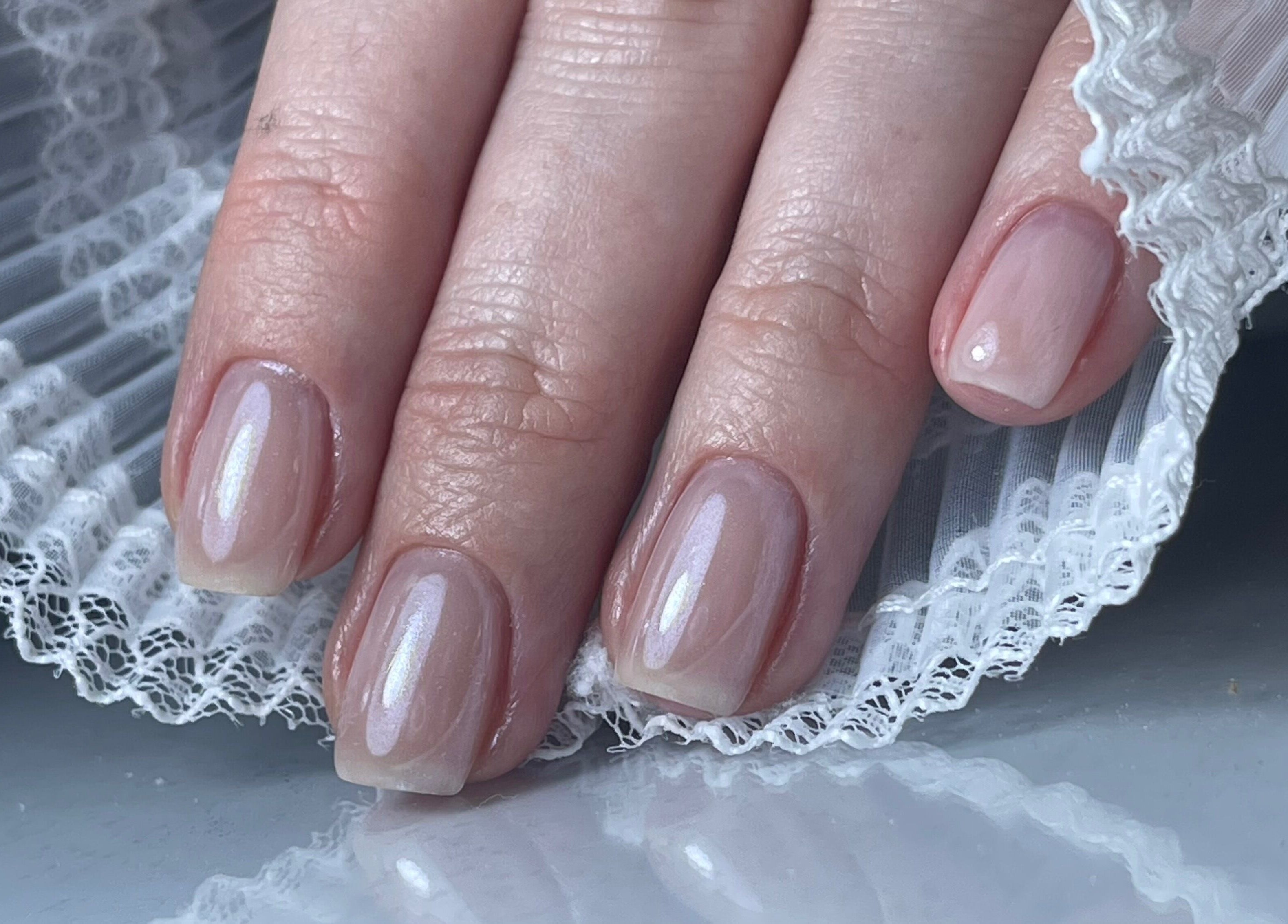Elegant manicure with lace detail at n.15Studio in Addlestone, England, GB.