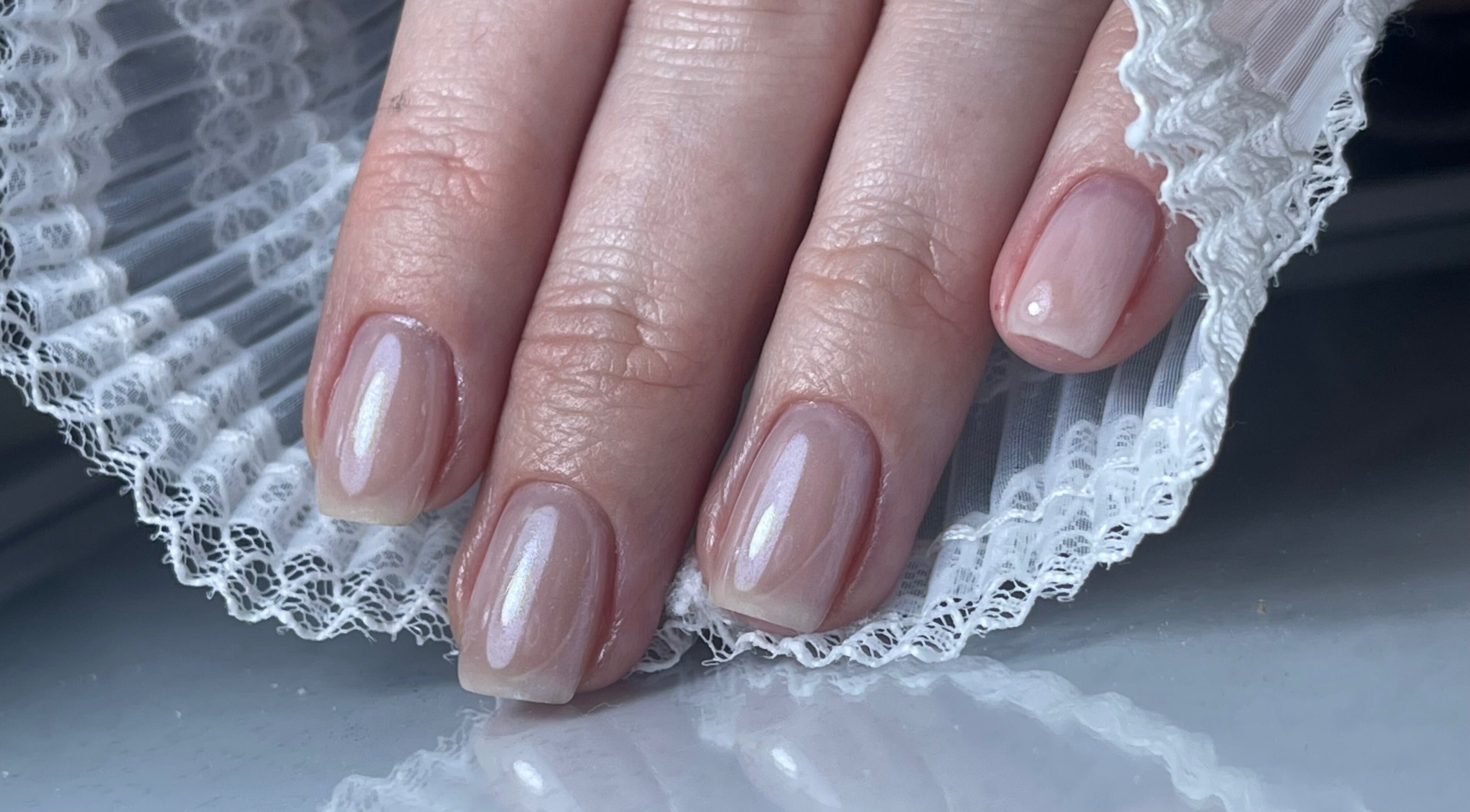Elegant manicure with lace detail at n.15Studio in Addlestone, England, GB.