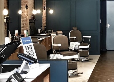 Elegant interiors of Hermanos Barbershop Loop Street in Cape Town, Western Cape, ZA with stylish barber chairs.