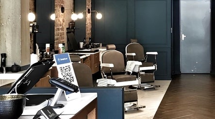 Elegant interiors of Hermanos Barbershop Loop Street in Cape Town, Western Cape, ZA with stylish barber chairs.
