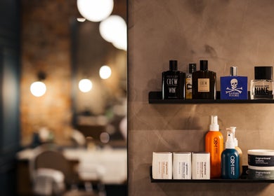 Shelf with grooming products at Hermanos Barbershop Loop Street, Cape Town, Western Cape, ZA.