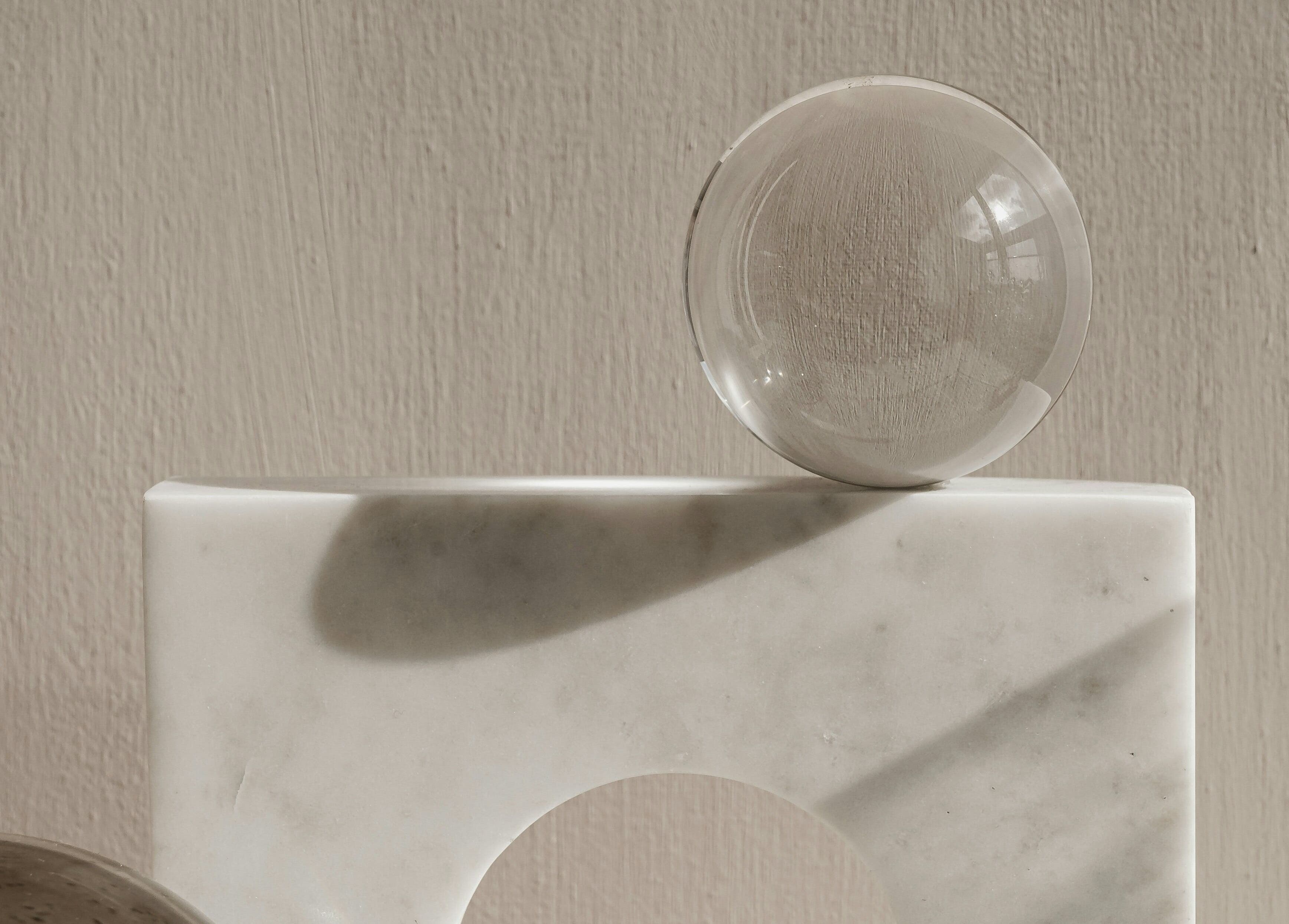 Elegant crystal sphere atop stone in Hermanos Aesthetics, Cape Town, Western Cape, ZA.