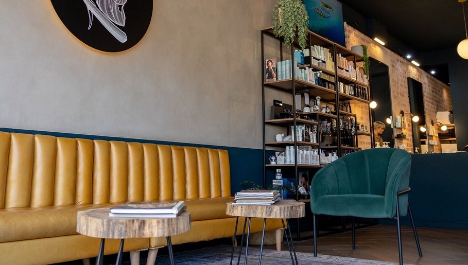 Stylish waiting area at Hermanos Barbershop Green Point, Cape Town, Western Cape, ZA.