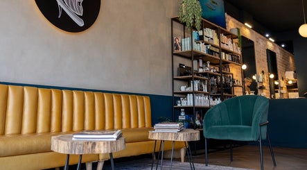 Stylish waiting area at Hermanos Barbershop Green Point, Cape Town, Western Cape, ZA.