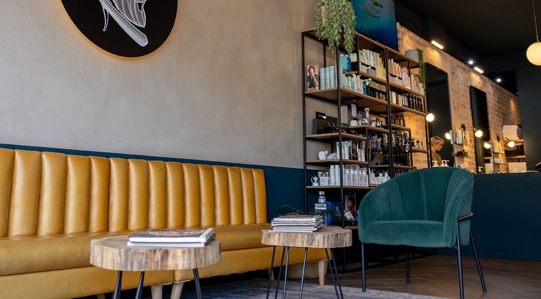 Stylish waiting area at Hermanos Barbershop Green Point, Cape Town, Western Cape, ZA.