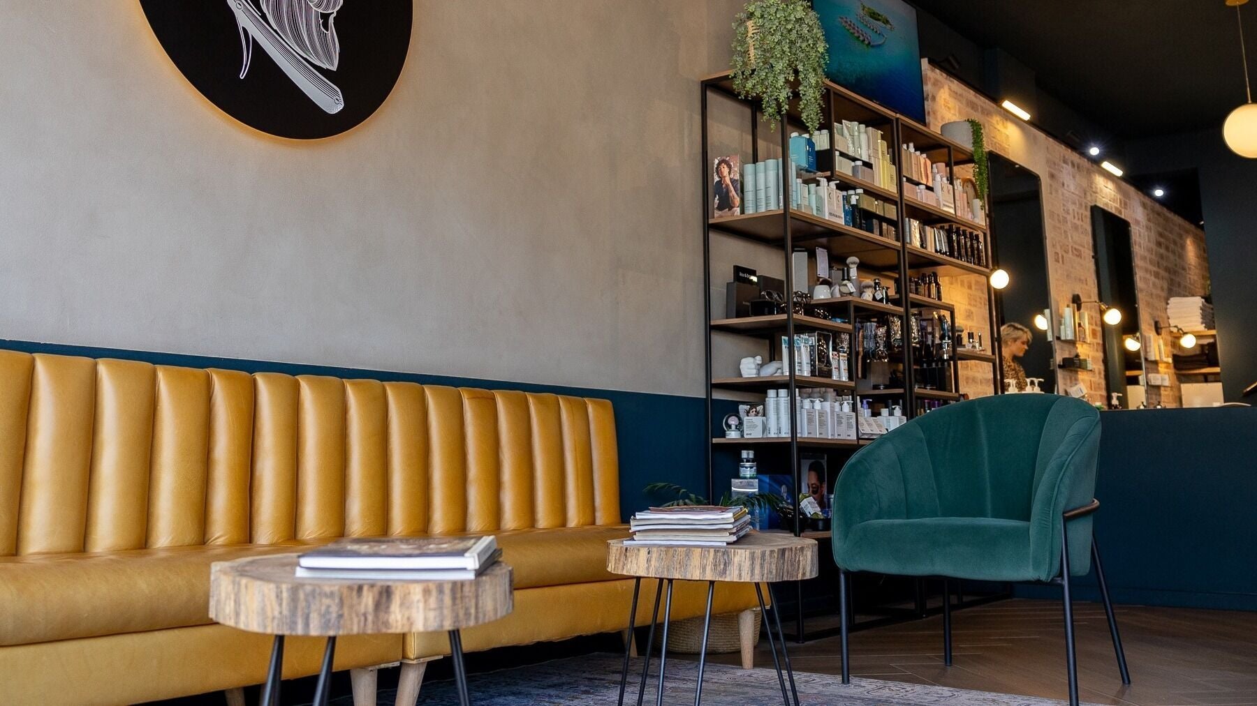 Stylish waiting area at Hermanos Barbershop Green Point, Cape Town, Western Cape, ZA.