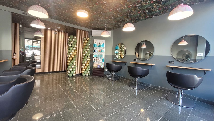 Modern salon interior at Carly at Artistic Hair Co. in Bristol, England, GB with stylish seating and decor.