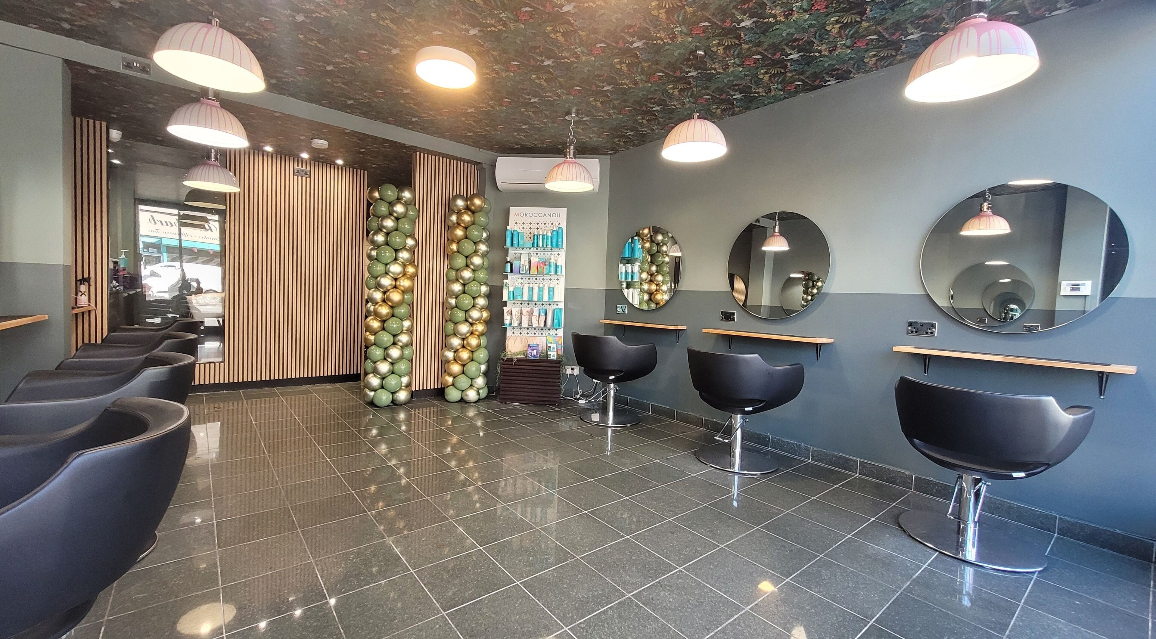 Modern salon interior at Carly at Artistic Hair Co. in Bristol, England, GB with stylish seating and decor.