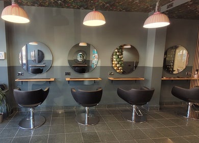 Modern salon interior with stylish chairs at Carly at Artistic Hair Co. in Bristol, England, GB.