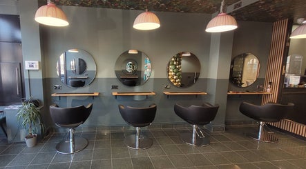 Modern salon interior with stylish chairs at Carly at Artistic Hair Co. in Bristol, England, GB.