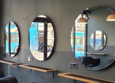 Elegant mirror setup at Carly at Artistic Hair Co., Bristol, England, GB reflecting modern salon design.