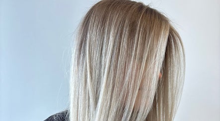 Smooth blonde hairstyle at Envy Hair Company, Fort Pierce, Florida, US.