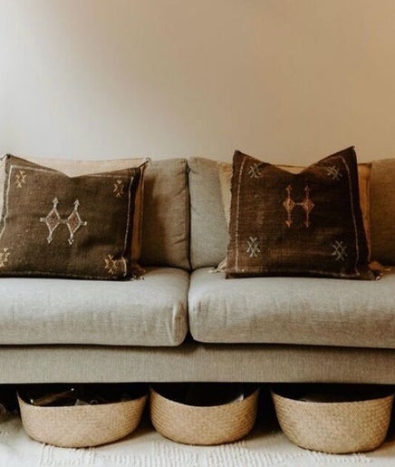 Stylish lounge at Hair by Danika Cahill, Vancouver, British Columbia, CA with plush decor and plants.