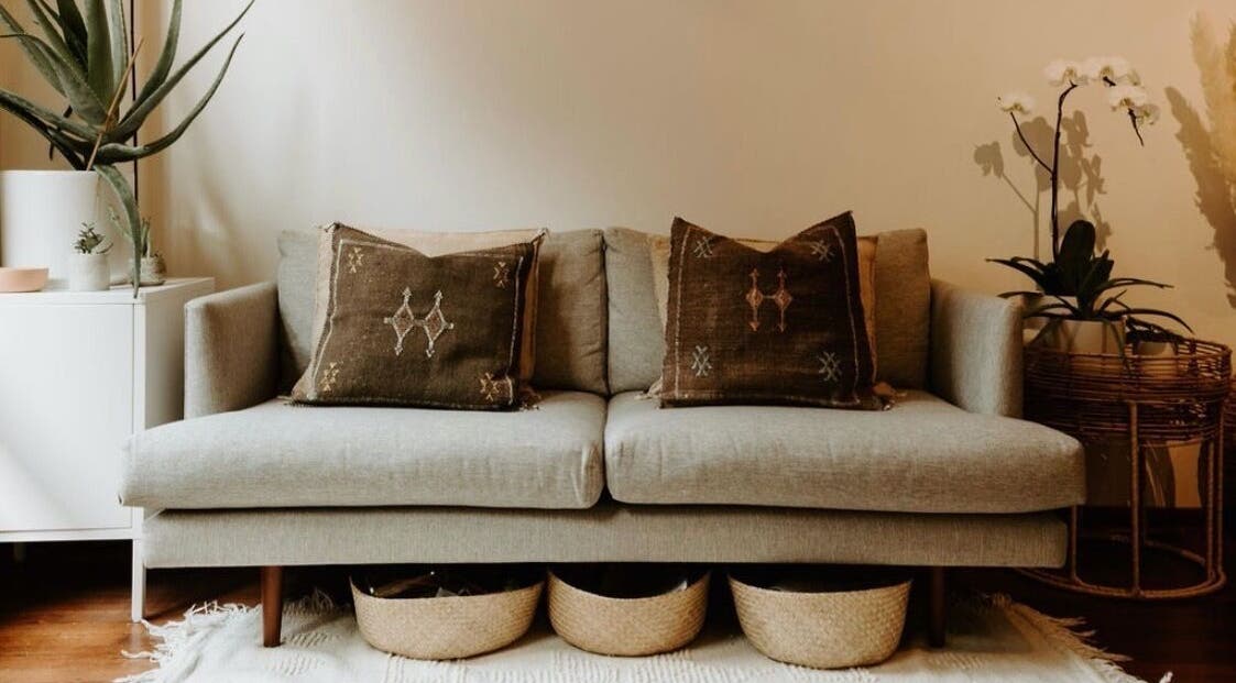 Stylish lounge at Hair by Danika Cahill, Vancouver, British Columbia, CA with plush decor and plants.