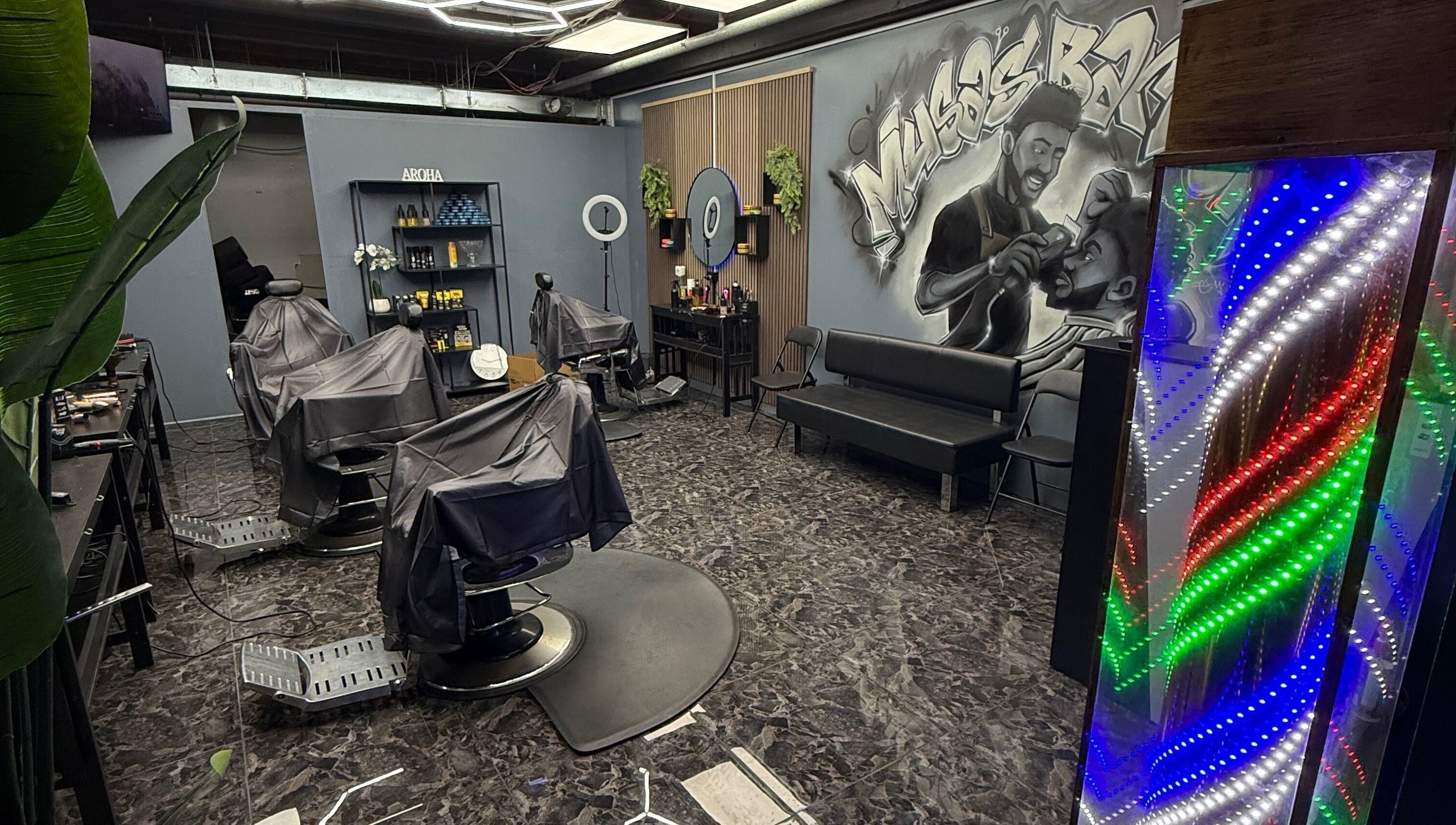 Modern interior of Musa’s Barber Auckland, featuring stylish chairs and vibrant decor. Located in Auckland, Auckland, NZ.