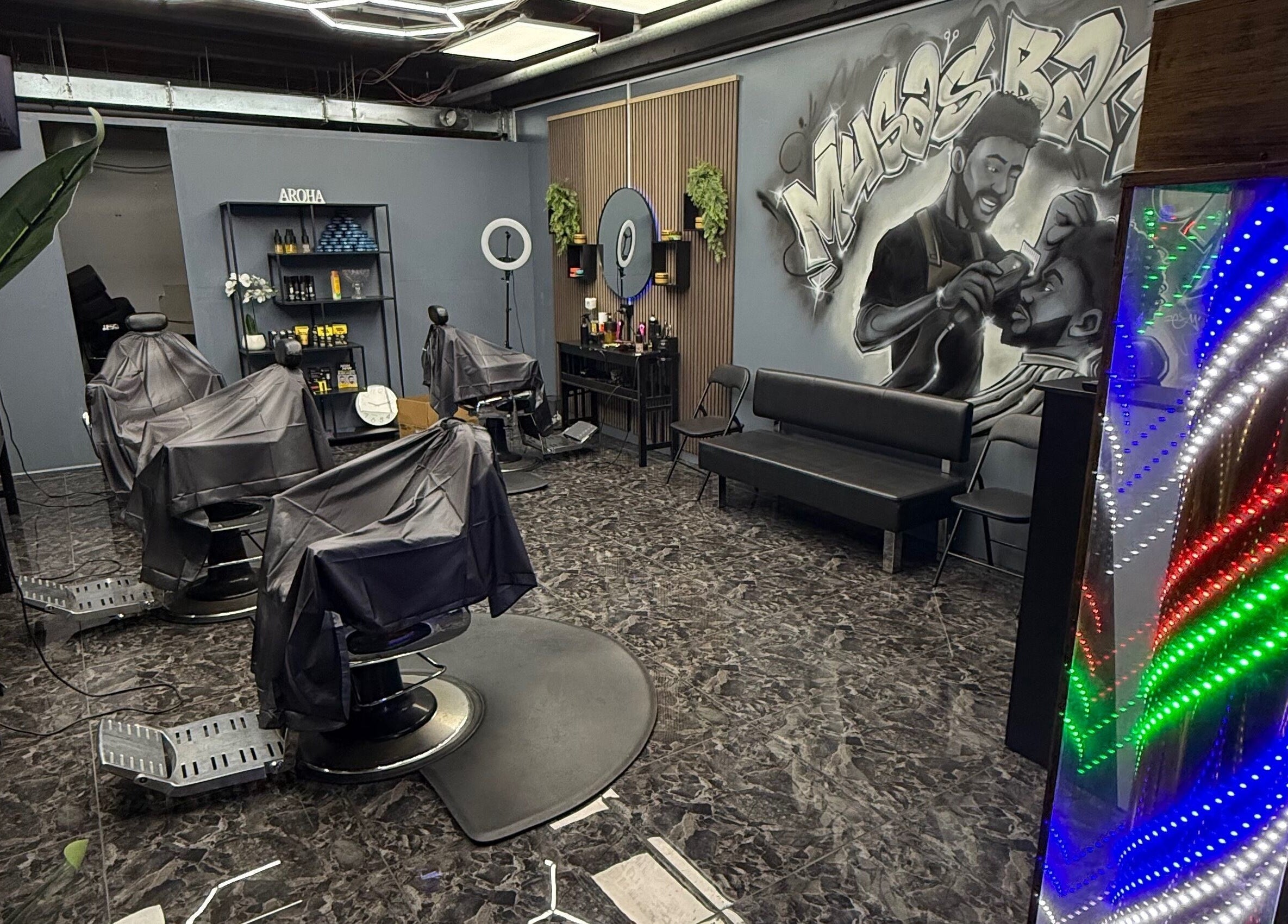 Modern interior of Musa’s Barber Auckland, featuring stylish chairs and vibrant decor. Located in Auckland, Auckland, NZ.