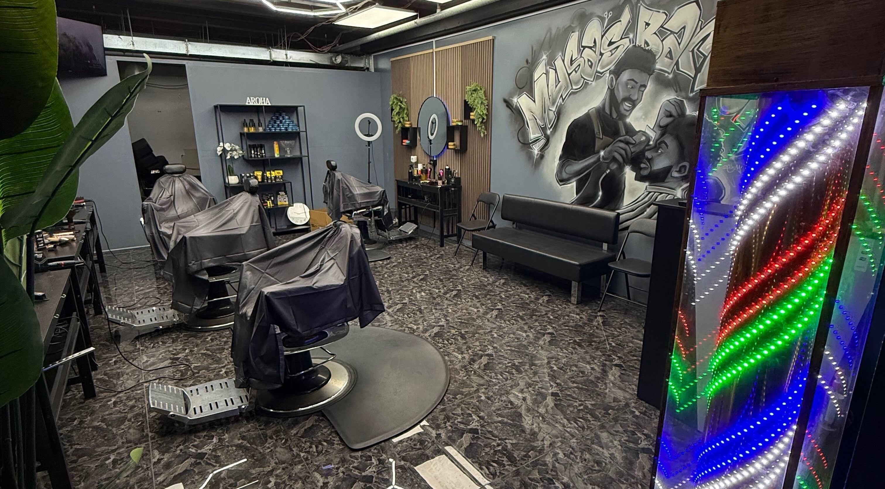 Modern interior of Musa’s Barber Auckland, featuring stylish chairs and vibrant decor. Located in Auckland, Auckland, NZ.