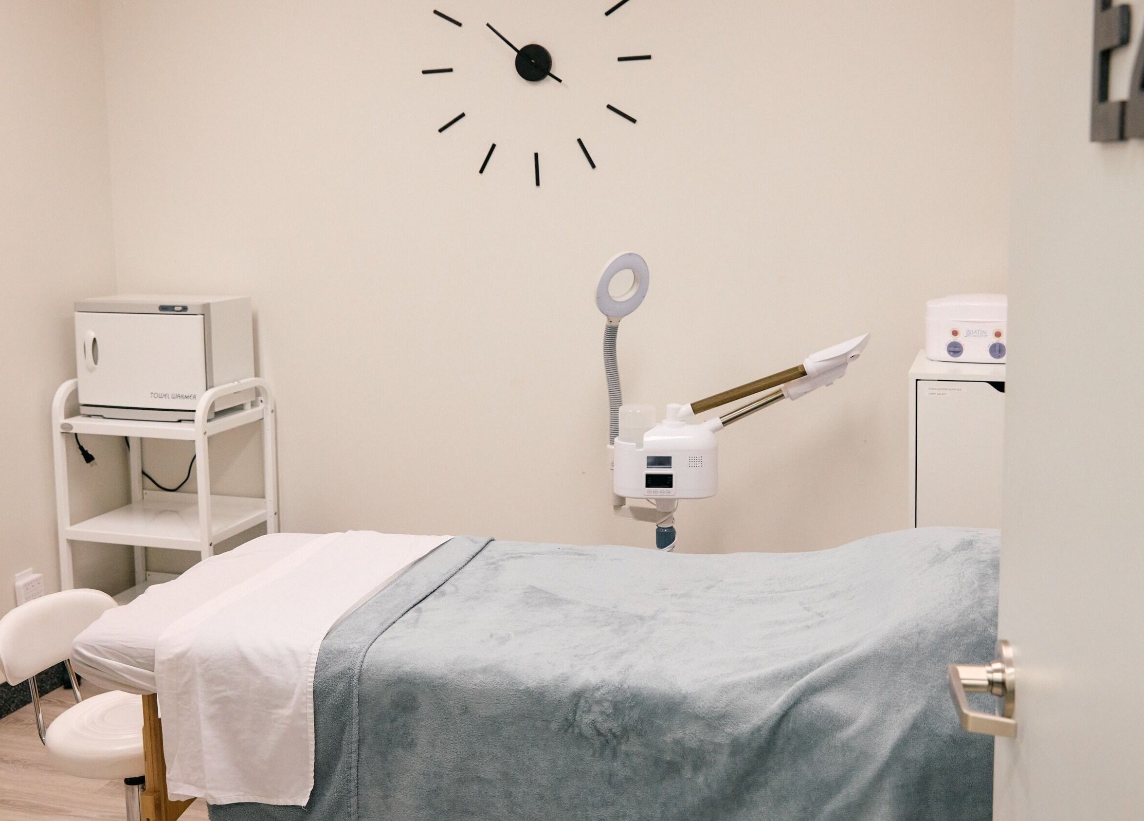 Massage room at Salt and Stone Massage Therapy, Saskatoon, Saskatchewan, CA, featuring a cozy treatment bed.