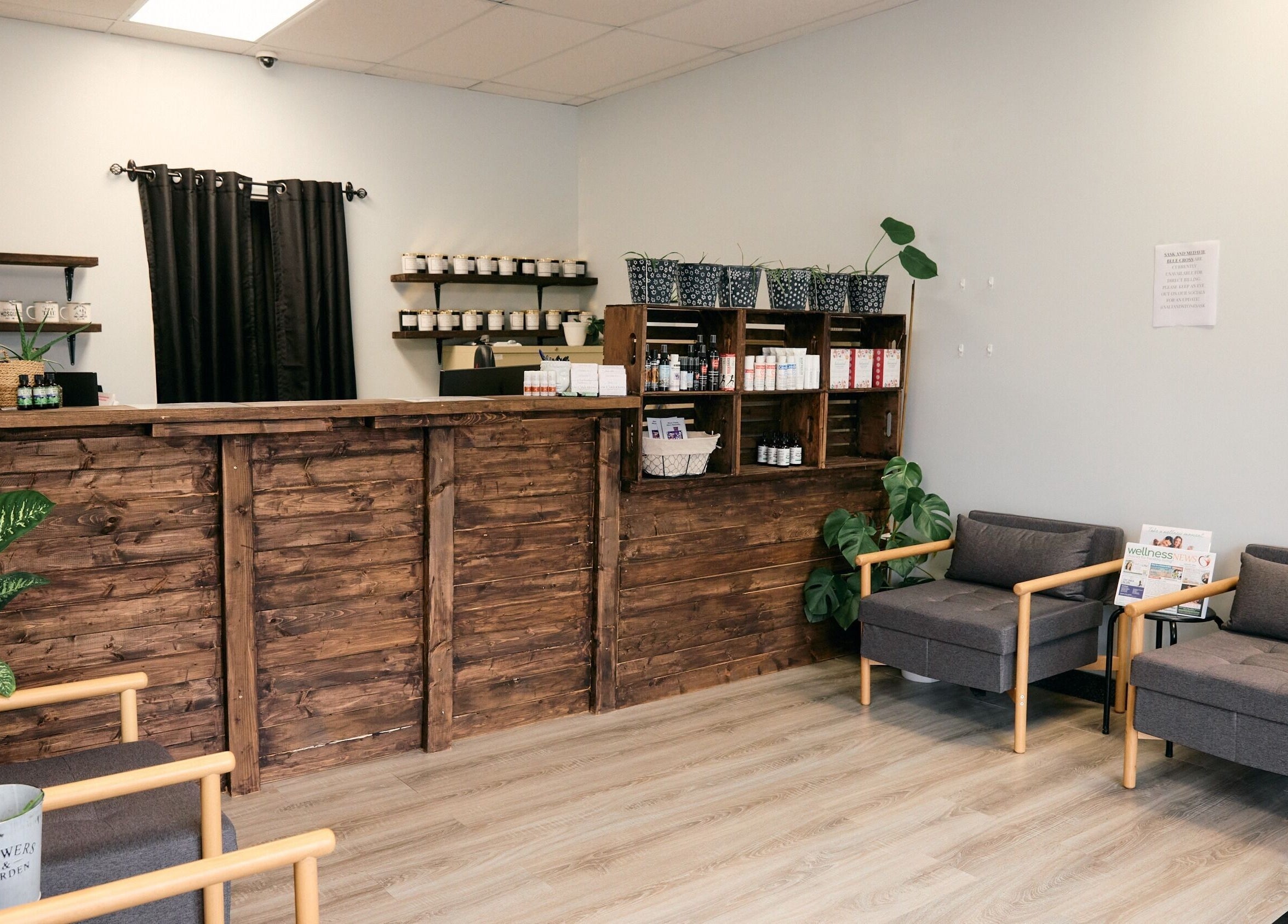 Reception of Salt and Stone Massage Therapy in Saskatoon, Saskatchewan, CA with wooden decor and seating area.