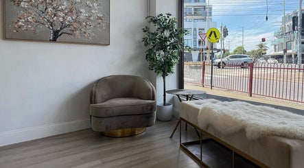 Comfortable seating area at The Brow Design Co, Bentleigh East, Victoria, AU, featuring plush chairs and natural decor.