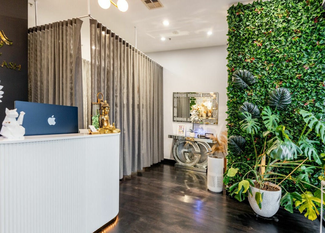Sophisticated Sol Brow and Lash reception in Melbourne, Victoria, AU with greenery wall and elegant decor.