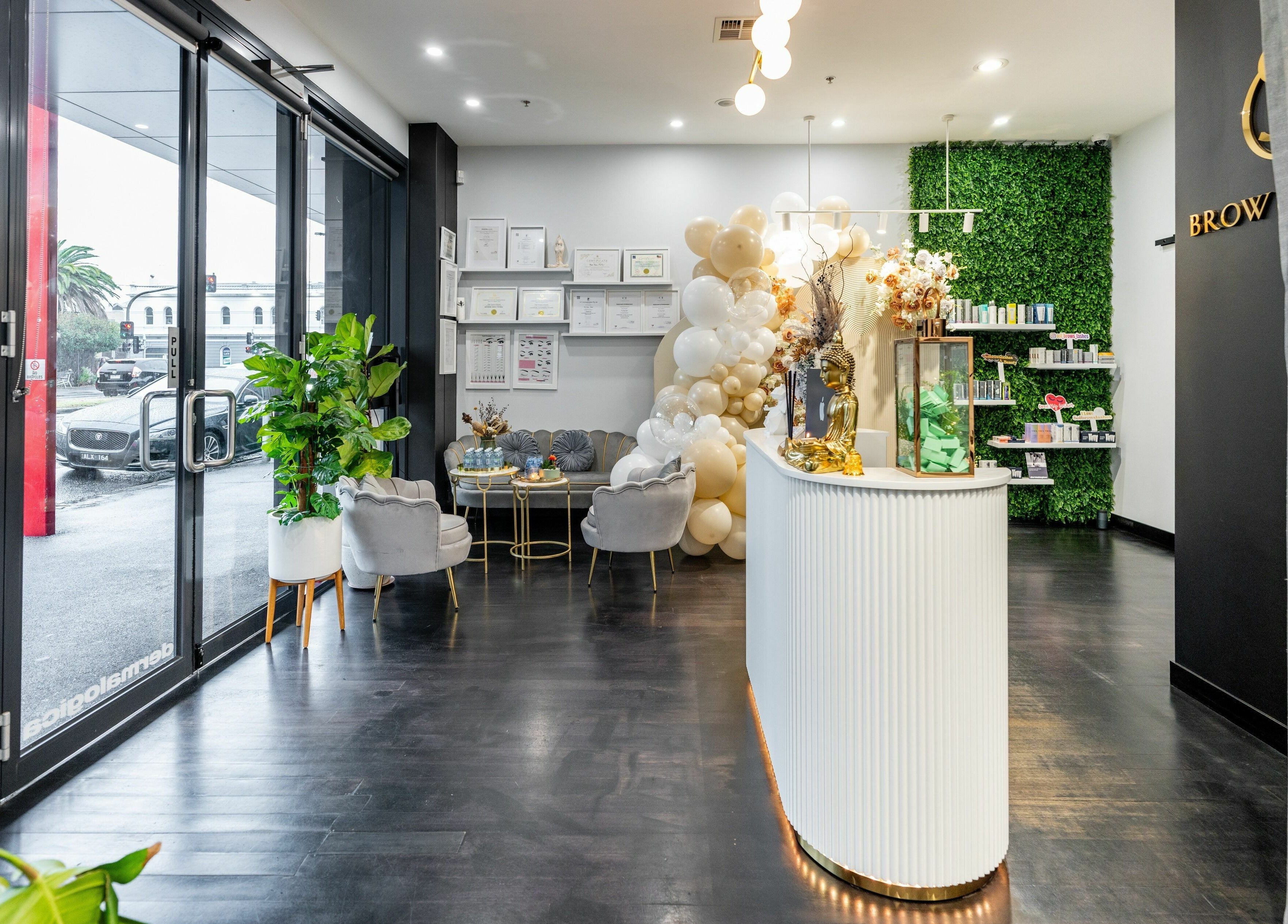 Elegant lounge at Sol Brow and Lash, Melbourne, Victoria, AU with plush chairs and vibrant decor.