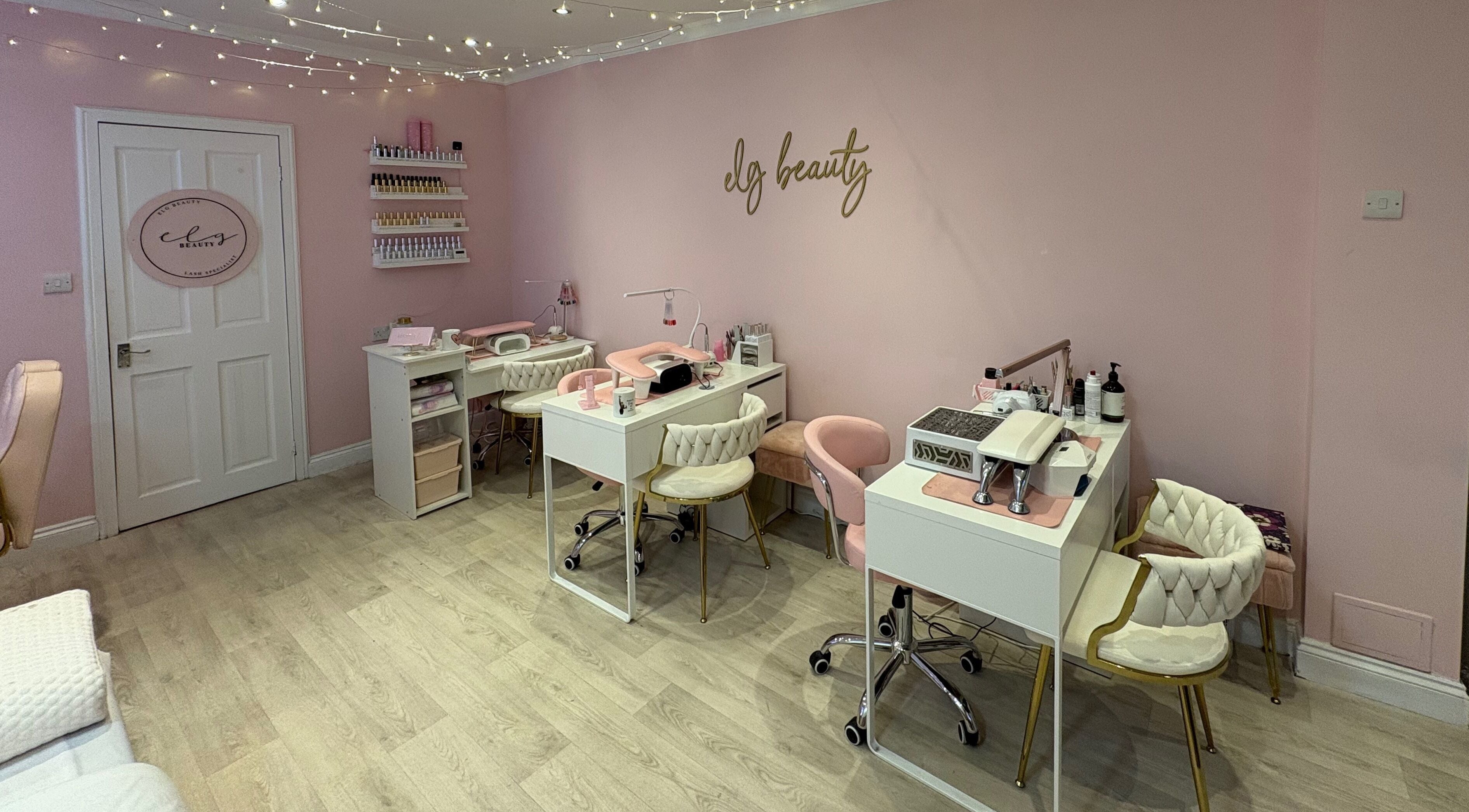 Chic interior of Elg Beauty in Cardiff, Wales, GB, showcasing elegant salon stations and decor.