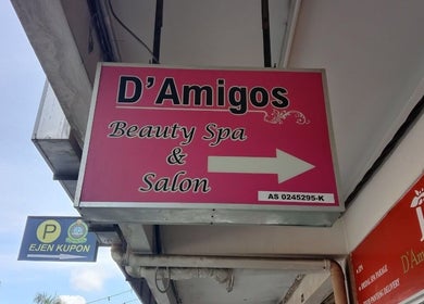 Exterior sign of D'Amigos Beauty Spa and Salon Muslimah in Changlun, Kedah, MY featuring pink branding.