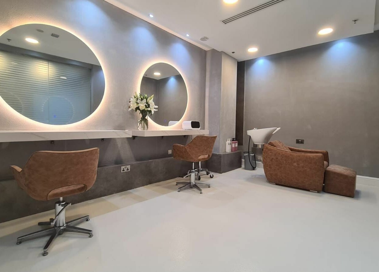 Modern styling chairs and mirrors at Grafton Salon, Dubai, AE, offering a luxurious beauty experience.