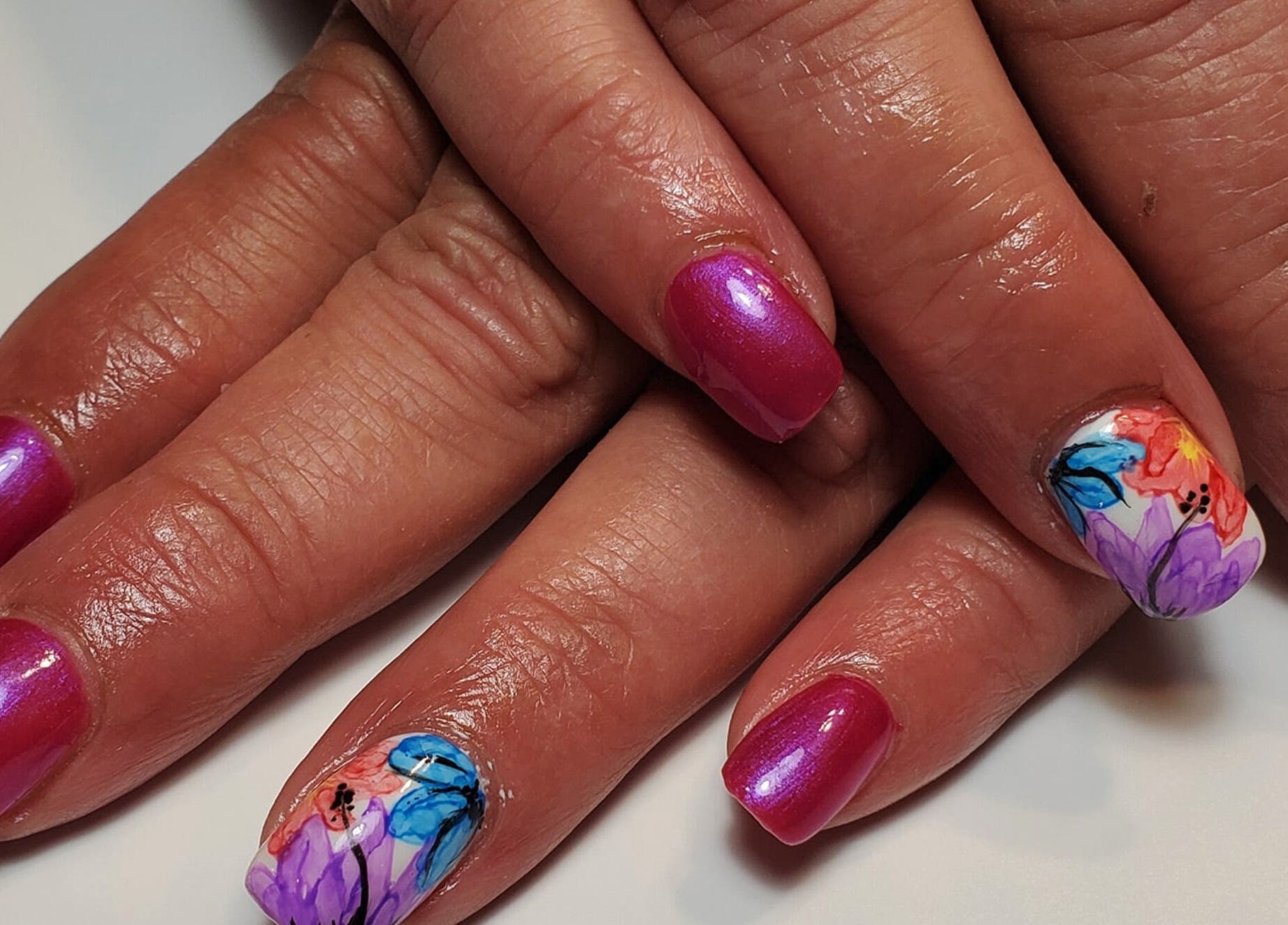 Bright floral nails at Nixi's Nails Salon in Roundup, Montana, US feature bold colors and artistic design.