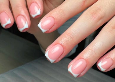 Stylish manicured nails at Charrpillbeauty, Harrogate, England, GB showcasing a modern French design.