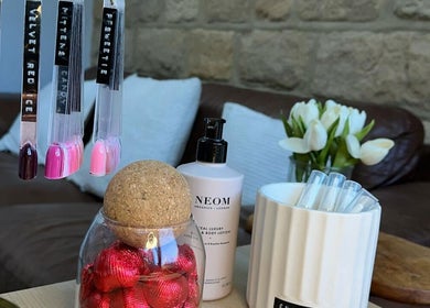 Charrpillbeauty nail polish selection in Harrogate, England, GB with cozy decor and lotions.