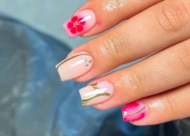 Elegant floral manicure design at Charrpillbeauty, Harrogate, England, GB, showcasing intricate nail art.