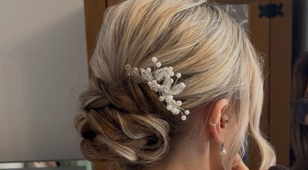 Intricate bridal hairstyle with accessories at Caylee Heath Bridal Hair, Waterlooville, England, GB.