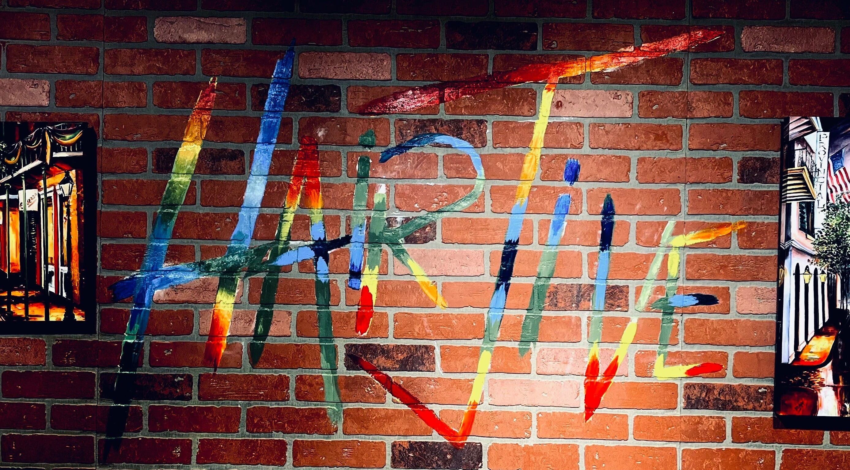 Colorful mural at Hair Jive, Covington, Louisiana, US, showcasing creative salon ambiance.