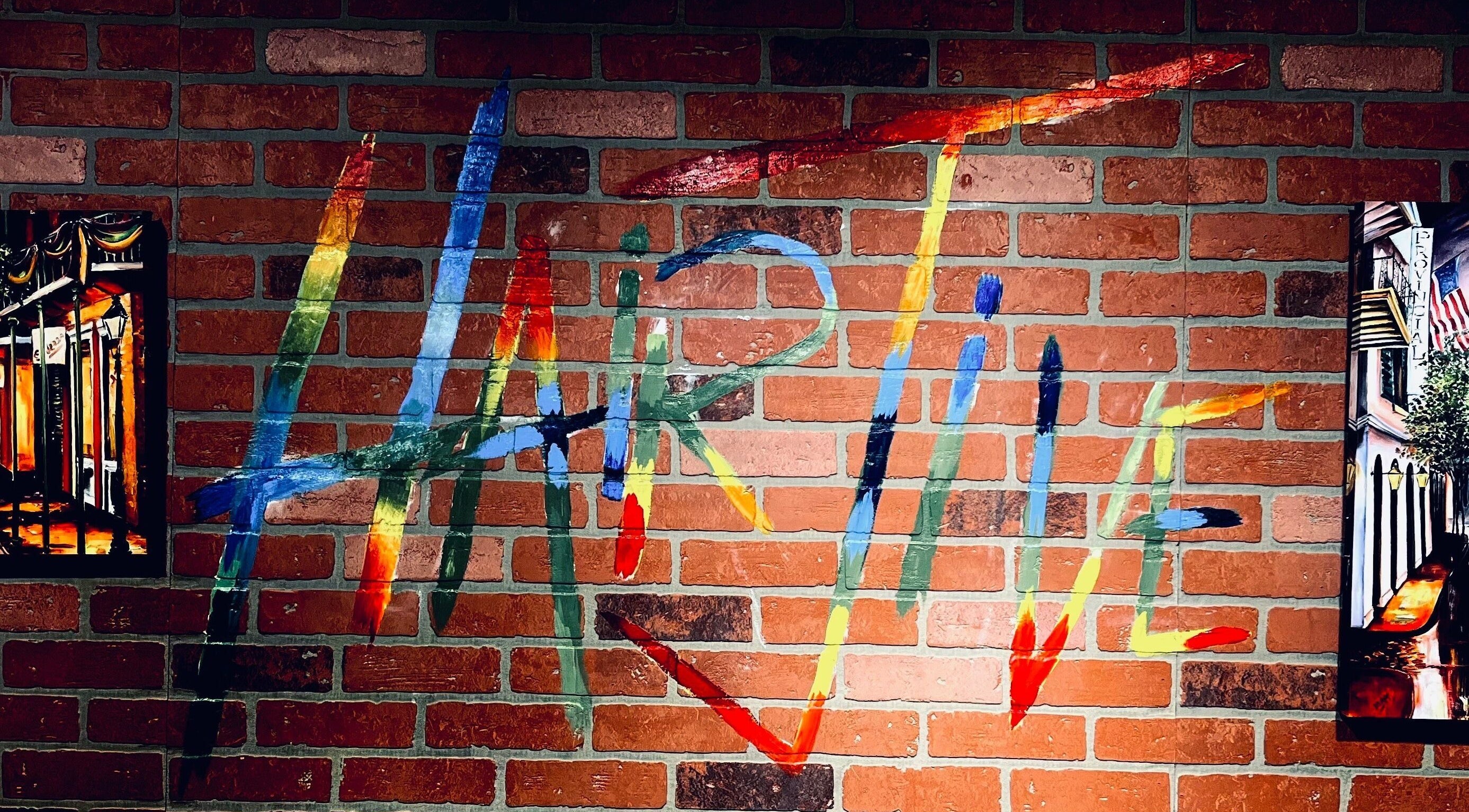 Colorful mural at Hair Jive, Covington, Louisiana, US, showcasing creative salon ambiance.