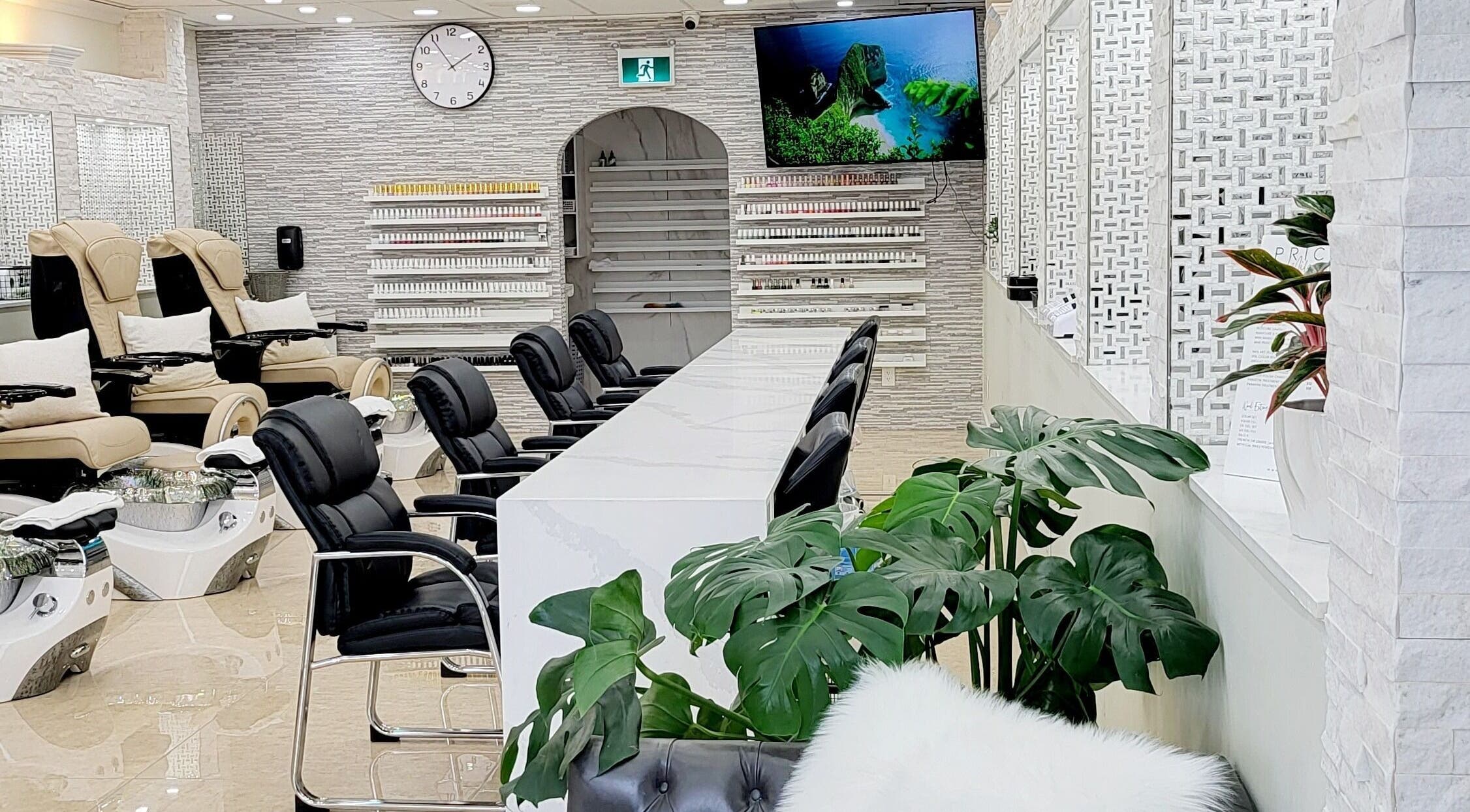 Elegant interior of Milano Nail Spa in Vancouver, British Columbia, CA featuring plush seating and decor.