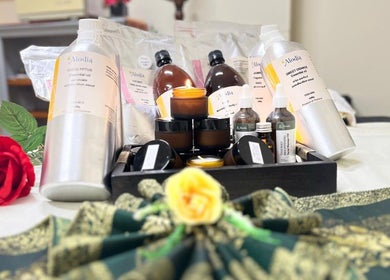 Therapeutic oils and candles at Panwa Massage and Therapy in Auckland, Auckland, NZ on a beautifully decorated table.