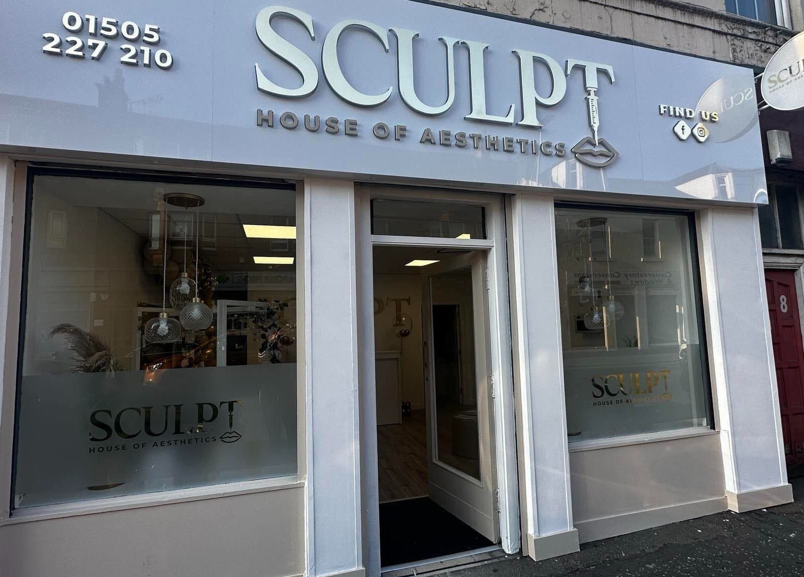 Front view of Sculpt House of Aesthetics in Johnstone, Scotland, GB, showcasing elegant signage and glass windows.