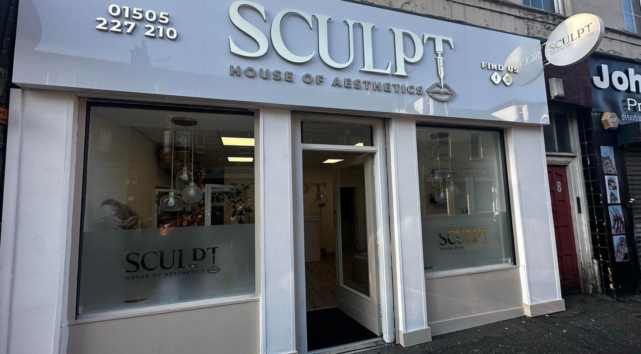 Front view of Sculpt House of Aesthetics in Johnstone, Scotland, GB, showcasing elegant signage and glass windows.