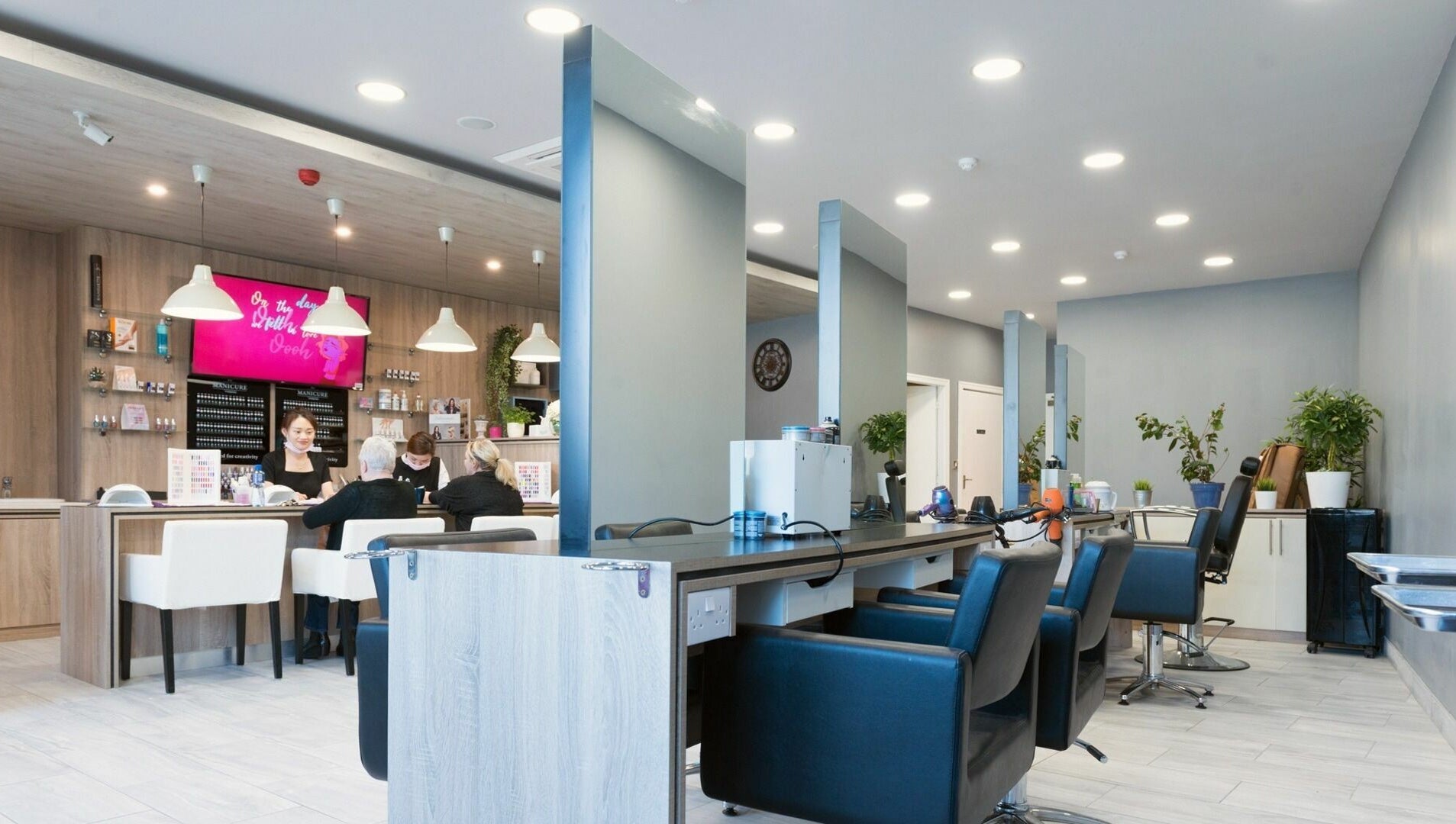 Modern interior of Salon Express Tallaght in Dublin, County Dublin, IE, featuring sleek styling stations and plush chairs.