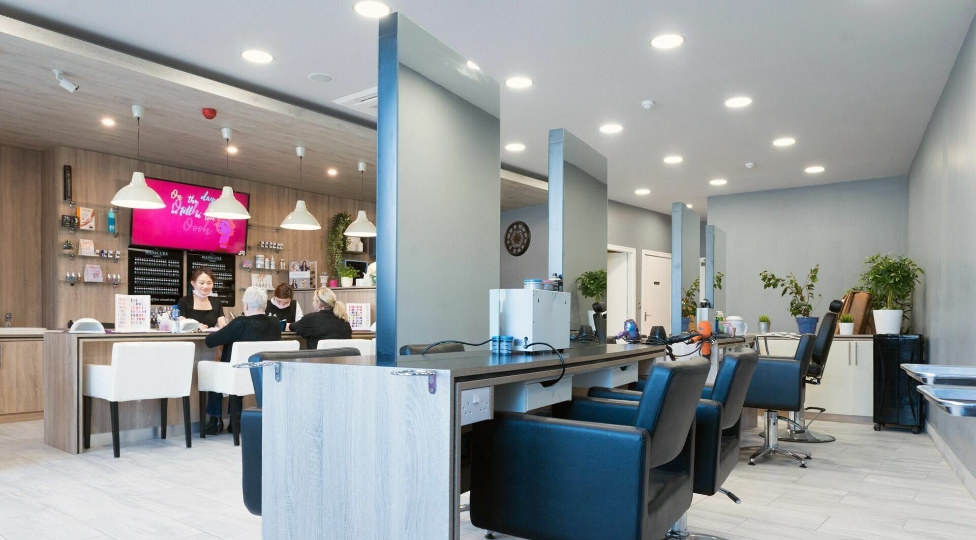 Modern interior of Salon Express Tallaght in Dublin, County Dublin, IE, featuring sleek styling stations and plush chairs.
