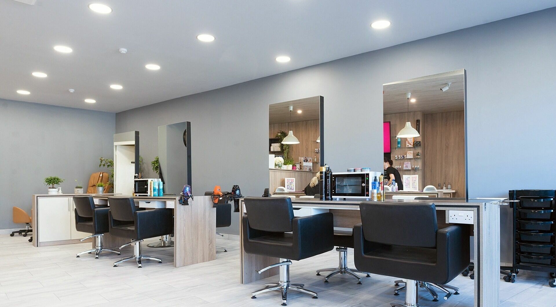 Modern salon interior at Salon Express Tallaght, Dublin, County Dublin, IE featuring sleek chairs and mirrors.
