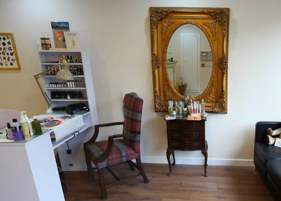 All About You salon in Blairgowrie, Scotland, GB, featuring a stylish interior with a large ornate mirror.