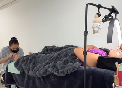 Clients enjoy nail and lash treatments at Good Omen Studio, Hong Kong Island, HK.