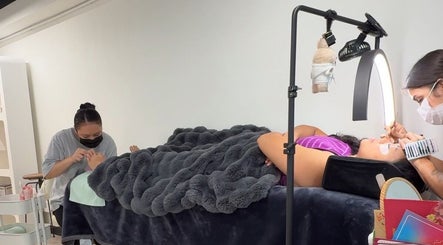 Clients enjoy nail and lash treatments at Good Omen Studio, Hong Kong Island, HK.