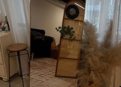 Cozy corner at Good Omen Studio, Hong Kong Island, HK, with stool, plants, and soft lighting.