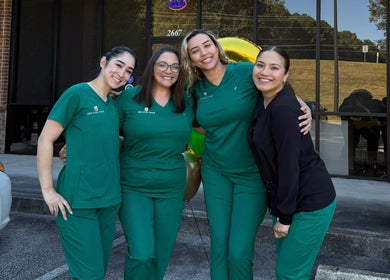 Team of Skin From Brazil staff smiling outside their Stockbridge, Georgia location.