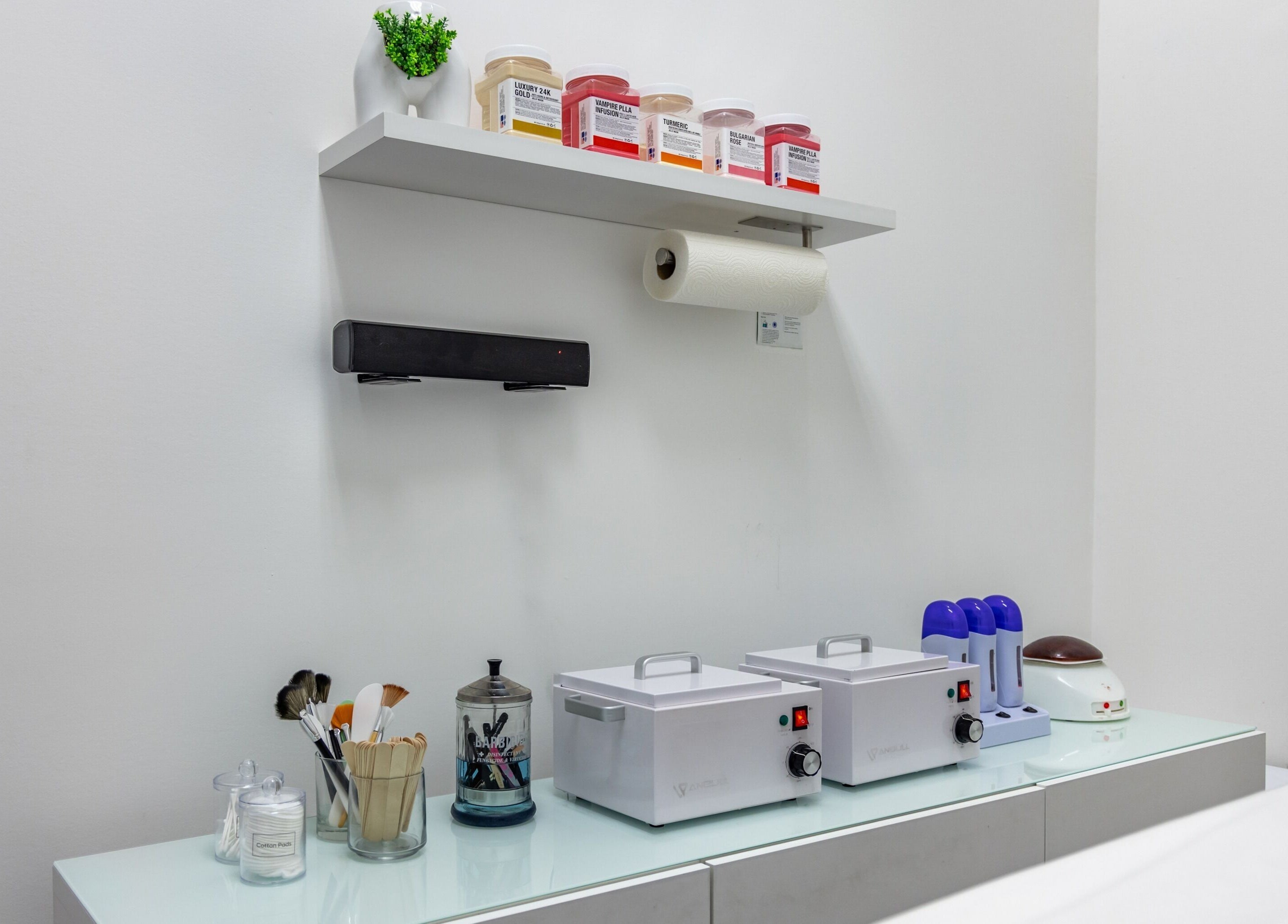 Professional beauty tools at Skin From Brazil in Stockbridge, Georgia, US, neatly arranged on a white shelf.